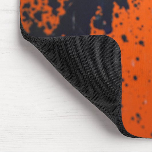Blpaint splatter on orange mousepad (Ecke)