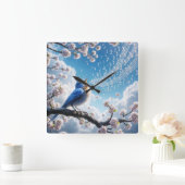 Bluebird singt auf einem Kirschbaumzweig Quadratische Wanduhr (Zuhause)