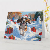 Bluetick Coonhound läuft im Schnee mit Weihnachten Karte (Gelbe Blume)
