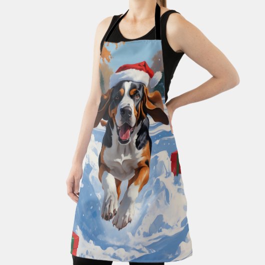 Bluetick Coonhound läuft im Schnee mit Weihnachten Schürze (InSitu)