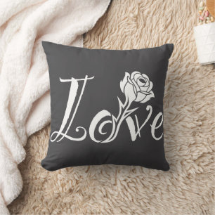 Blühende Liebe: Typografie mit floraler Drehung Kissen