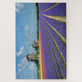 Blumen und Windmühlen in einer Frühlingslandschaft Puzzle