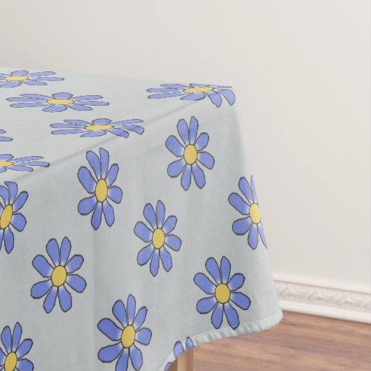 Blumenblau auf irgendeiner Farbe Tischdecke (Beispiel)