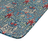 Blumenmuster auf grünen Blättern blauem Hintergrun Schneidebrett (Ecke)