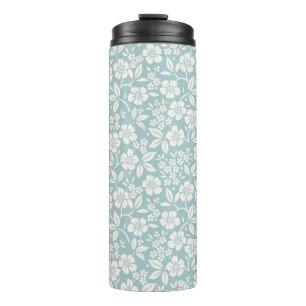 Blumenmuster. Hübsche Blumen auf graublauem Hinter Thermosbecher