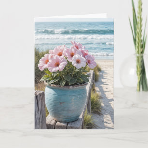 Blumentopf am Strand mit rosa Petunien Karte