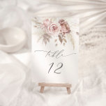 Blush Pink Dusty Rose Bloral Wedding Tischnummer<br><div class="desc">Treten Sie ein in ein Reich zeitloser Eleganz und flüsterter Versprechungen mit unserem exquisiten Stück, in dem die zarte Schönheit staubiger Blütenblätter mit dem sanften Reiz der pastellfarbenen Blüten verwoben wird. Dieses faszinierende Design verkörpert das Wesen von Romantik und Raffinesse, mit gedämpften, rot-gelben Botanicals, die zart angeordnet sind, um ein...</div>