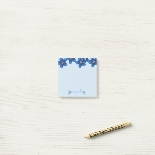 Blütenblüten der blauen Blume, die Zeichnend Anmer Post-it Klebezettel (Auf Schreibtisch)