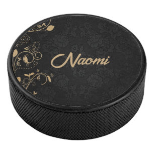Blütenstaube in Schwarz und Gold Eishockey Puck