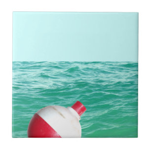 Bobber im Wasser fischen Fliese