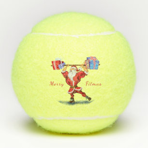 Bodybuilder Santa Claus mit Weihnachtsgeschenken - Tennisbälle