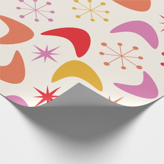 Boomerang Mitte des 20. Jahrhunderts mit farbenfro Geschenkpapier (Ecke)