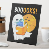 Booooks Halloween Ghost reading books and wearing Sockelschild (In Situ)