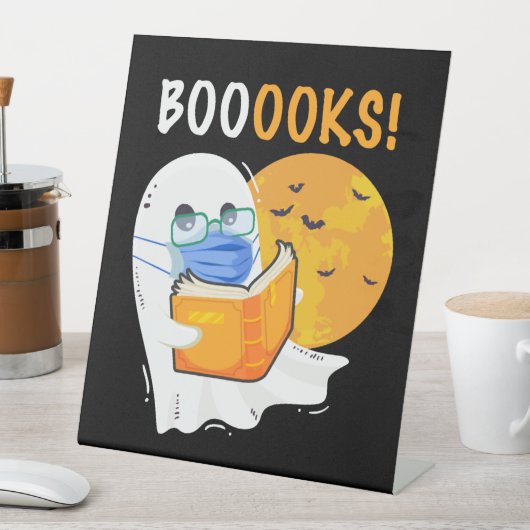 Booooks Halloween Ghost reading books and wearing Sockelschild (In Situ)