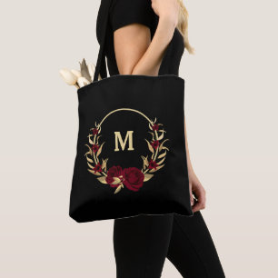 bordeauxfarbene Blume, goldene Blätter schwarz Tasche