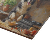 Border Collie Cooking in Kitchen Schneidebrett (Ecke)