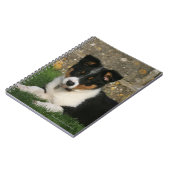 Border-Collie-Welpe mit Blatt im Mund Notizblock (Linke Seite)