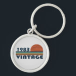 Born in 1983 vintage birthday schlüsselanhänger<br><div class="desc">You can add some originality to your wardrobe with this original 1983 vintage sunset retro-looking birthday design with awesome colors and typography font lettering, is a great gift idea for men, women, husband, wife girlfriend, and a boyfriend who will love this one-of-a-kind artwork. The best amazing and funny holiday present...</div>