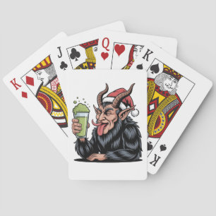 Böser Krampus trinkt grünen Matcha-Weihnachtstrank Spielkarten