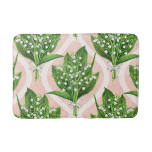 Bouquet der Lilie des Tals Blume auf rosa Badematte