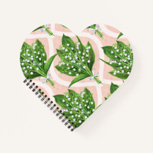 Bouquet der Lilie des Tals Blume auf rosa Notizblock