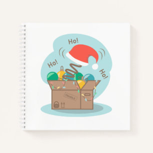 Boxbox mit Weihnachtsdekoration und Weihnachtsmann Notizblock