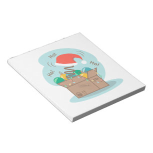 Boxbox mit Weihnachtsdekoration und Weihnachtsmann Notizblock