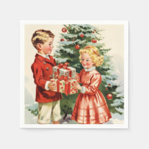 Boy and girl giving each other Christmas presents