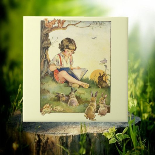 Boy reading under tree with rabbits fliese