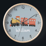 Boys Niedlich Blue Modern Travel Travel Baby Kinde Uhr<br><div class="desc">Diese niedliche und moderne Baby-Kinderzimmer-Uhr verfügt über eine Tourenansicht und einen Platz, in dem Sie den Namen Ihres Jungen hinzufügen können. Ideal für Kinder, die von einem Zugfahrer oder einem neuen Baby träumen! Mit klaren Zahlen und einem blauen Hintergrund ist diese Uhr auch ideal für Kleinkinder, die lernen, die Zeit...</div>