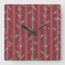 Branch of leaves on red wallpaper quadratische wanduhr