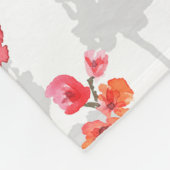 Branches of cherry blossoms on white and grey back fleecedecke (Ecke)