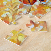 Braune Tischkatze auf einem bequemen Bett Puzzle (Seite)