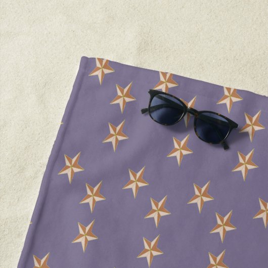 Braunsterne auf lila strandtuch (Beispiel)