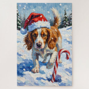 Bretonischer Spaniel Hund zeigt auf Weihnachtsbonb Puzzle