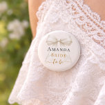 Bride to be ivory bow pearls elegant Bachelorette Button<br><div class="desc">Celebrate your special milestone with this chic bachelorette party button. The design features a luxurious ivory bow adorned with delicate pearl strands and sophisticated gold-toned script. It serves as a stylish accessory for the bride-to-be to wear during her bridal shower or night out with bridesmaids. Ivory background color.</div>
