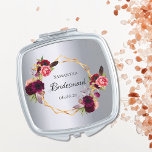 Bridesmaid Aquarellblumen bordeauxrot silber Taschenspiegel<br><div class="desc">Ein trendiges bohemianisches Geschenk für die Bridesmaid. Die Rose sind in Bordeaux und Rosa gehalten. Elegante Imitate silbermetallisch aussehender Hintergrund. Ein Imitat goldener geometrischer Rahmen. Mit dem Text: Bridesmaid geschrieben mit einem handgeschriebenen Stil Skript. Vorlage für den Bridesmaid-Namen und ein Datum. Schwarze Buchstaben. Ideal für eine Winterhochzeit!</div>