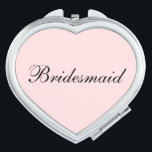 Bridesmaid Compact Mirror Taschenspiegel<br><div class="desc">Kompakter Spiegel in Herzform mit einer rot-rosa Hintergrundfarbe mit Bridesmaid Text in schwarz. Passen Sie dieses Objekt an oder kaufen Sie,  wie es ist.</div>