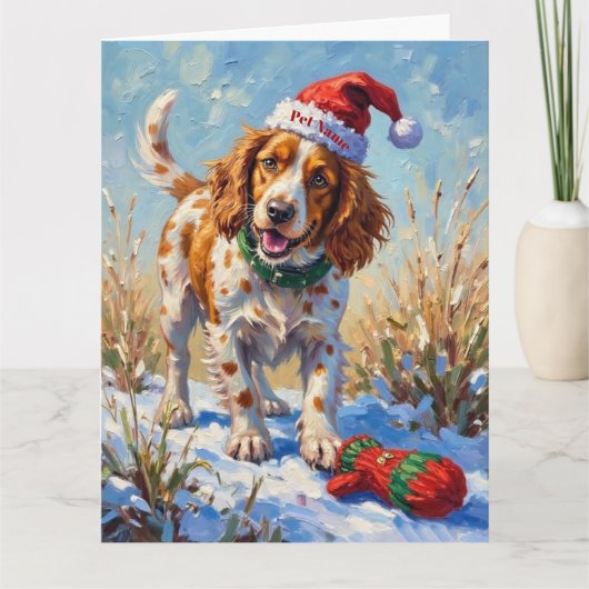 Brittany Spaniel Pointing at Santa's Glove Hat Karte (Vorderseite)