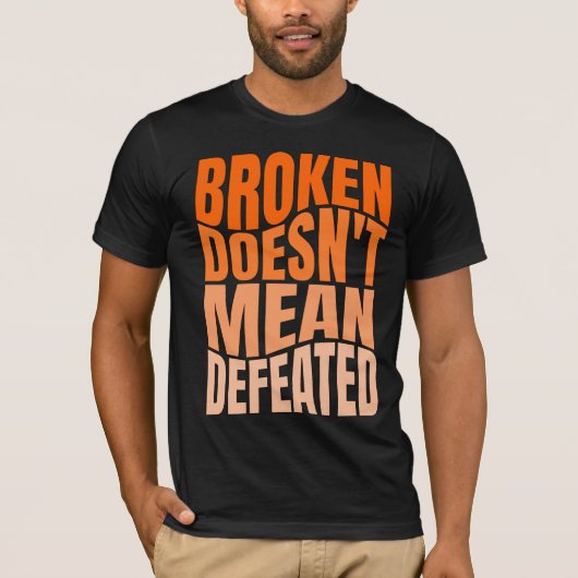 Broken Doesn’t Mean Defeated  T-Shirt (Vorderseite)