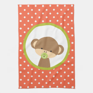 Brown Baby Monkey mit Schnuller auf Polka Dots Handtuch