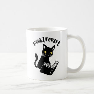 Buchtrovertekatze mit Buch Kaffeetasse