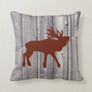 Bugling Elche auf rustikalem hölzernem Kissen
