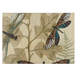 Bunte Libellen, die über Blätter schwimmen Schneidebrett