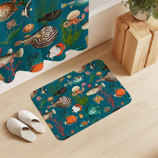 Bunte Ozeanien-Fische auf türkisfarbenem Hintergru Badematte