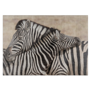 Burchell-Zebras beim Ringen Schneidebrett