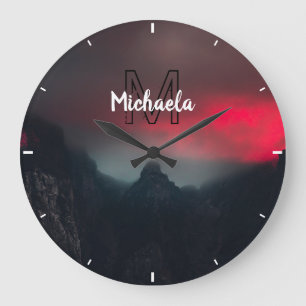 Burning clouds, fog and mountains monogram in sky große wanduhr
