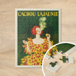 Cachou Lajaunie | Leonetto Cappiello Puzzle<br><div class="desc">Cachou Lajaunie (1920) | Leonetto Cappiello präsentiert in seinem 1920 erschienenen Plakat für Cachou Lajaunie ein auffallendes Bild einer Rothaarfrau in einem kühnen roten und gelben Ziegenkleid, die elegant raucht und einen dunkelgrünen Hintergrund hat. Die lebhaften Farben und die dynamische Pose der Frau erwecken sofort die Aufmerksamkeit und reflektieren Cappiello'...</div>