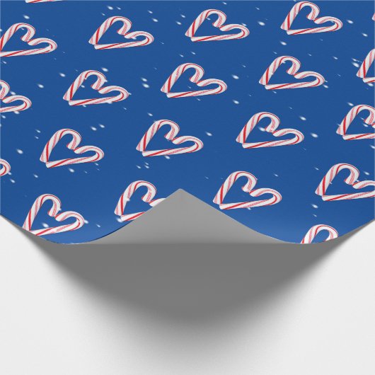 Candy Cane hört in Schneeflocken auf blau Geschenkpapier (Ecke)
