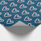 Candy Cane hört und schneebedeckt auf blau Geschenkpapier (Ecke)